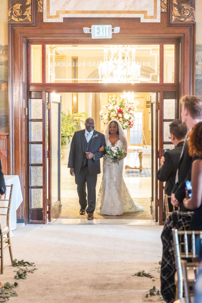 Bride walking down aisle with father