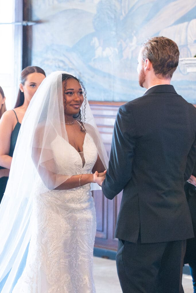 Bride smiling at groom