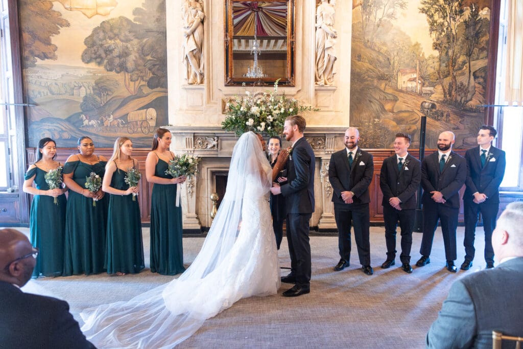 bride and groom smiling during ceremony