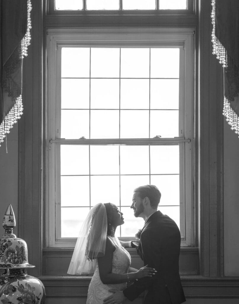 married bride groom window shot