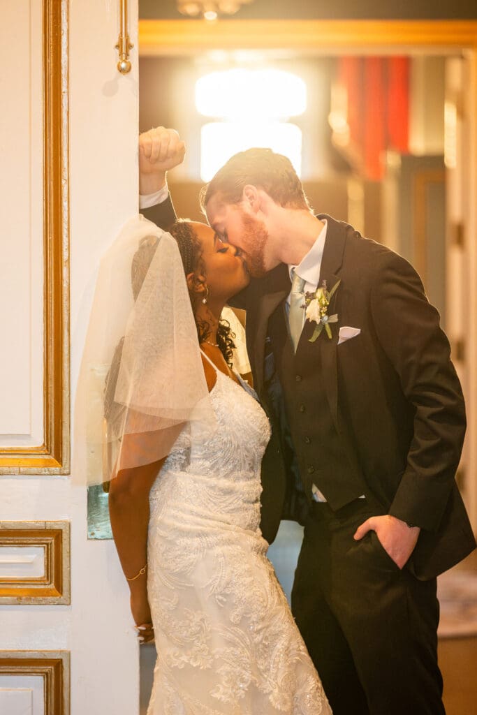bride groom kissing sunlight background