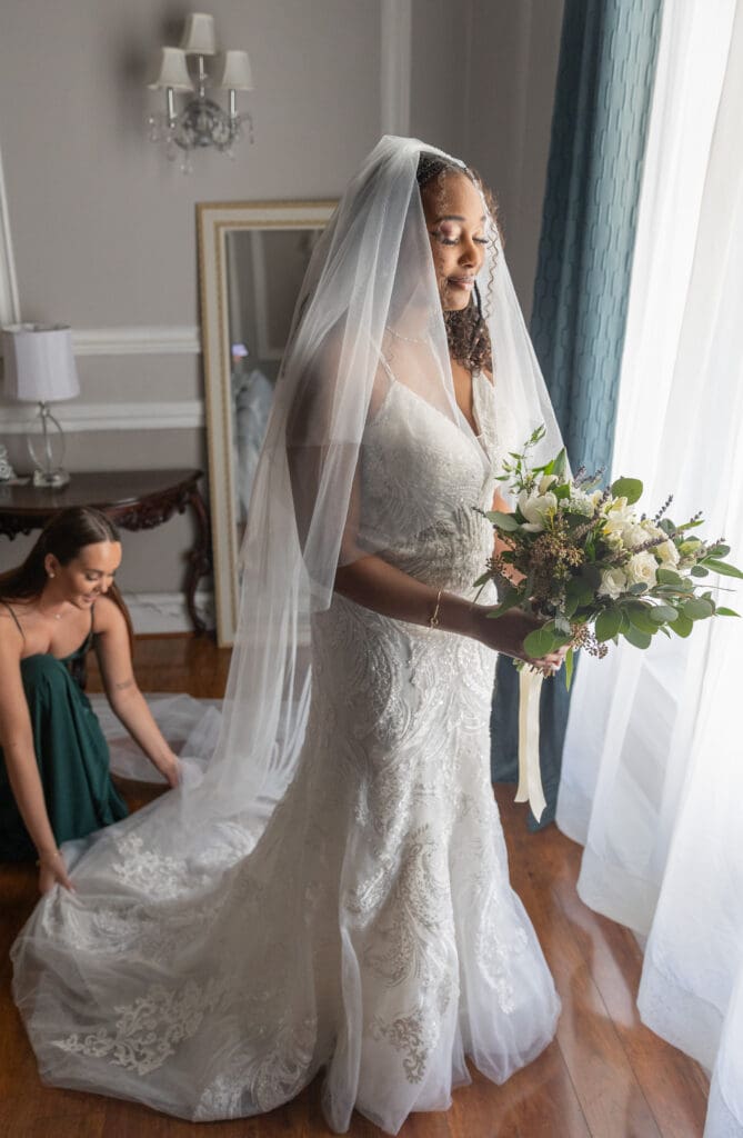 Bride looking at bouquet