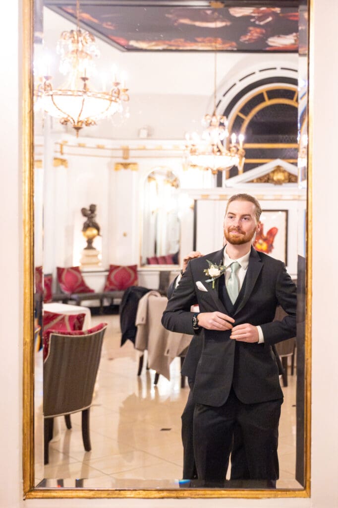 Groom getting ready buttoning tuxedo location belvedere baltimore