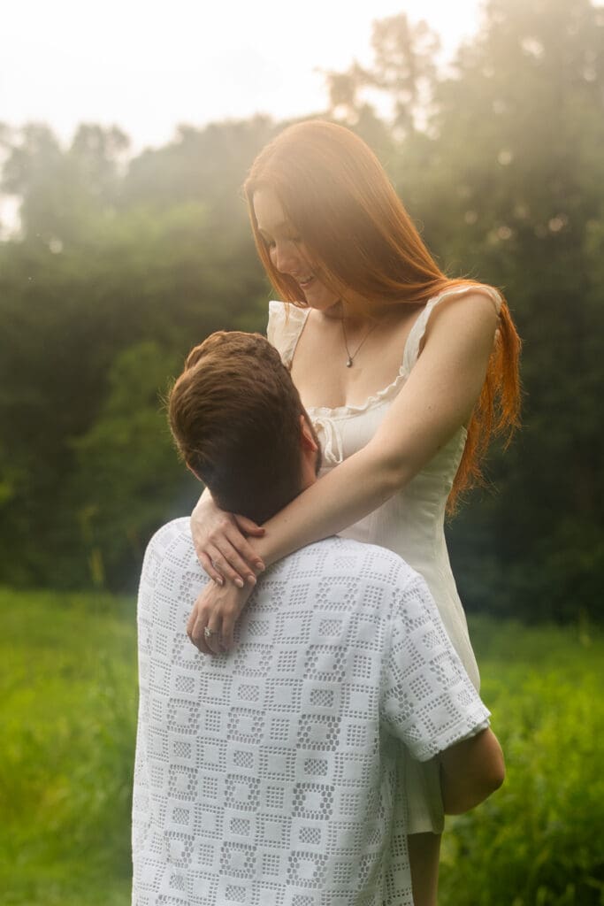 Rainy romantic engagement couple hugging located at Ellanor C. Lawrence Park in Chantilly, Virginia