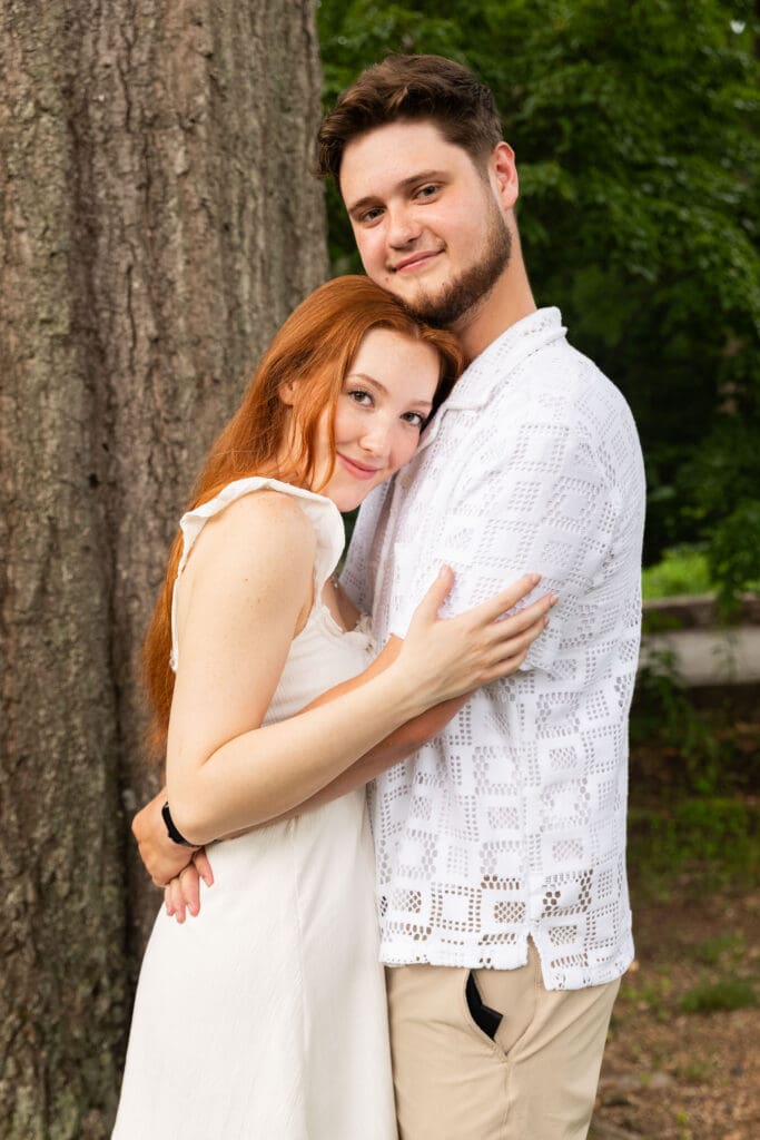 Engaged couple hugging each other located in Cabell's Mill