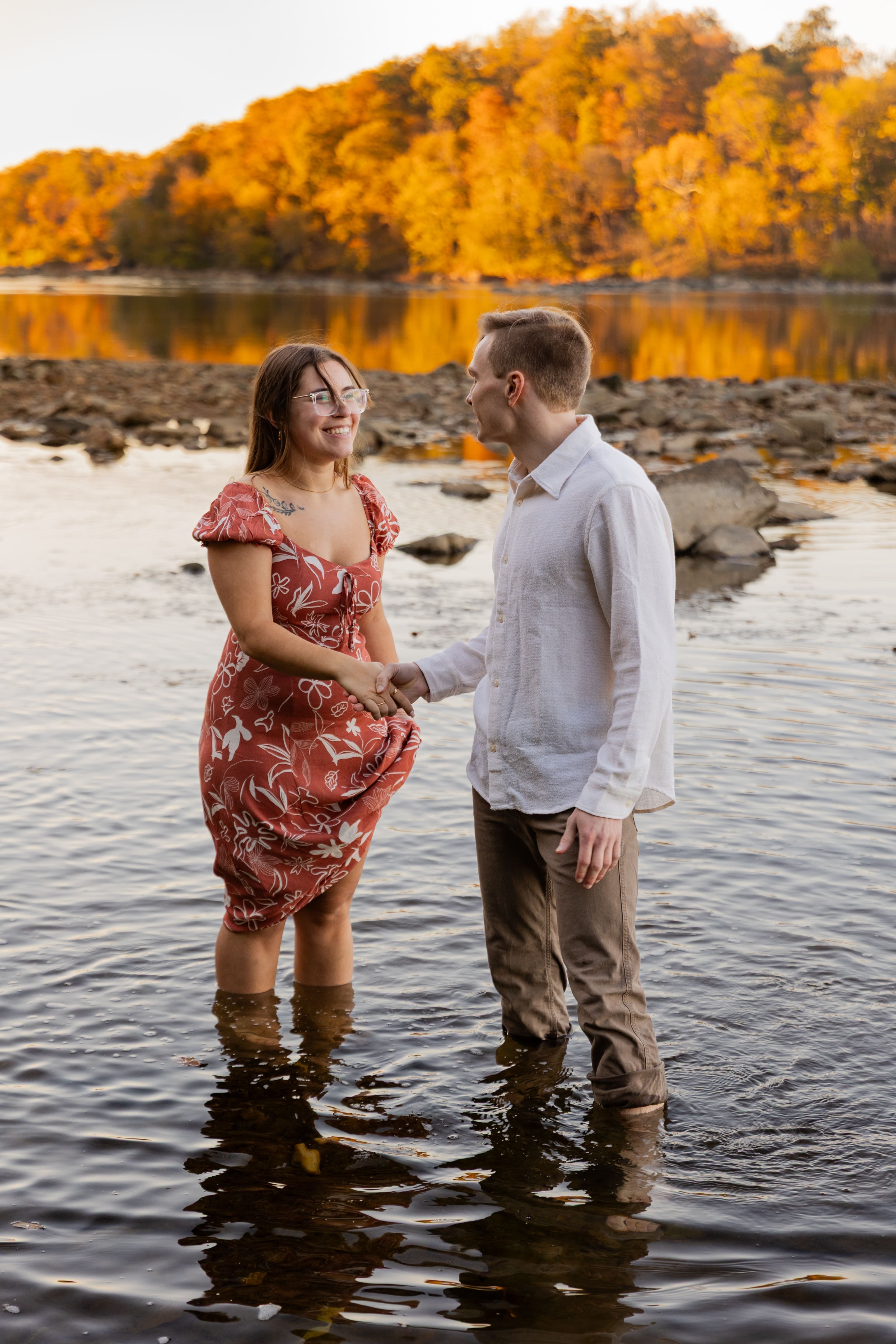 Scott's Run in Virginia engagement couple holding hands