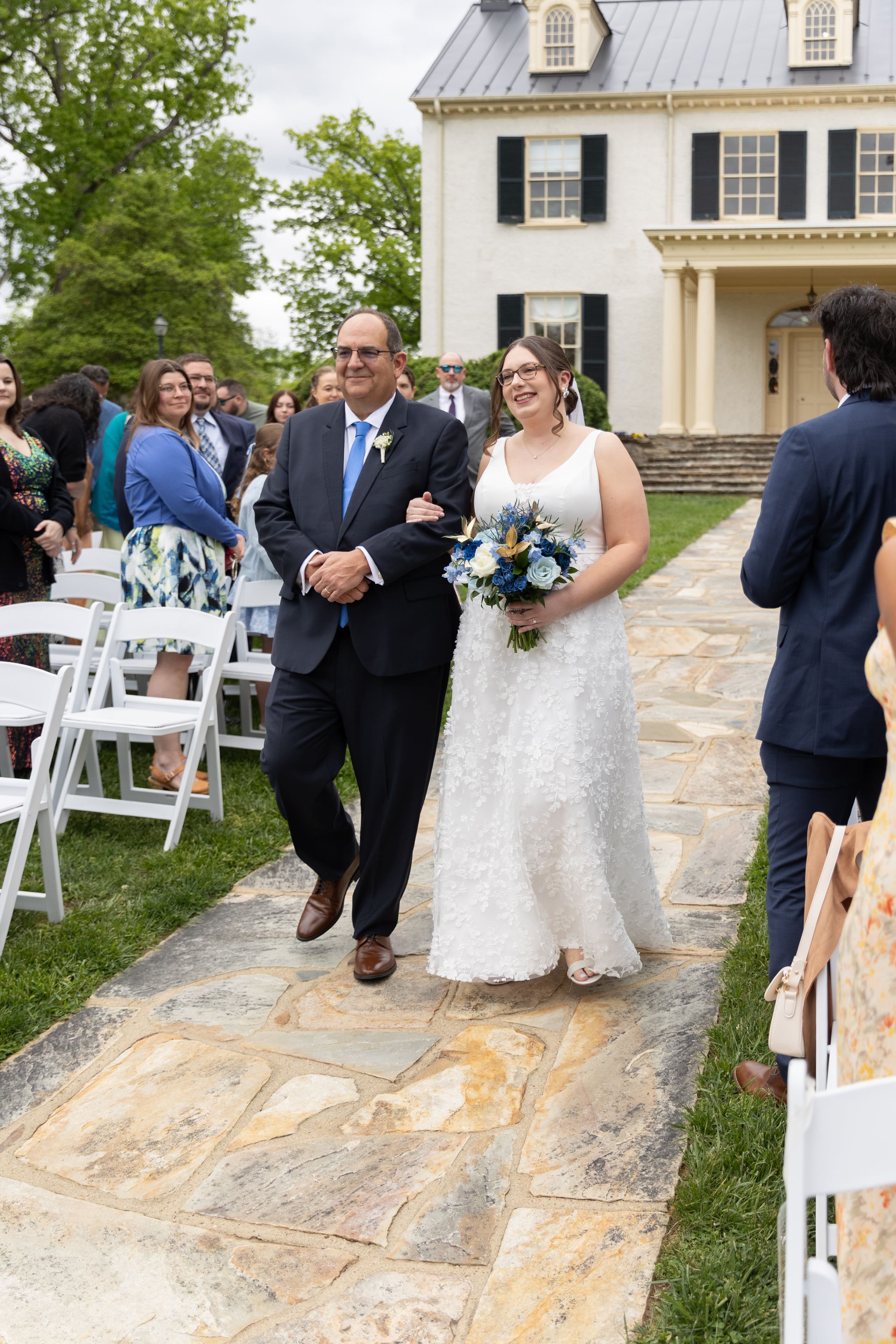 bride and father walk down aisle